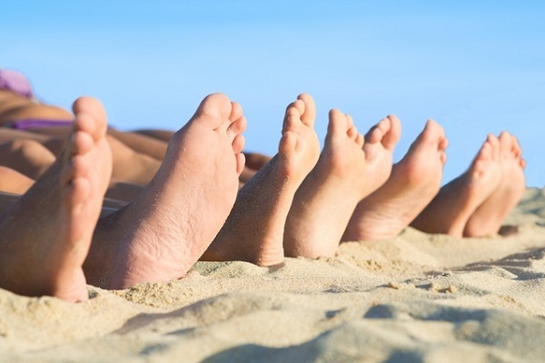 Feet relax at beach